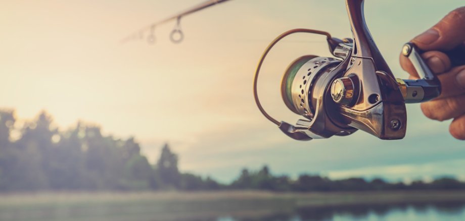 Fishing on the lake at sunset. Fishing background.